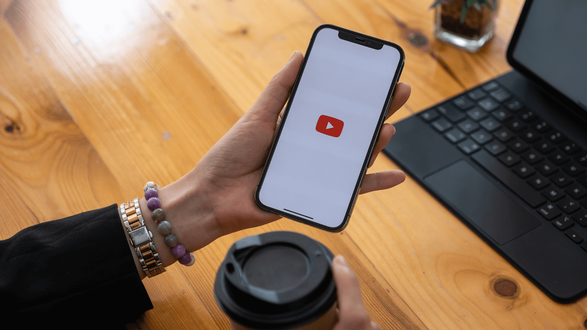 woman using the YouTube app on her phone
